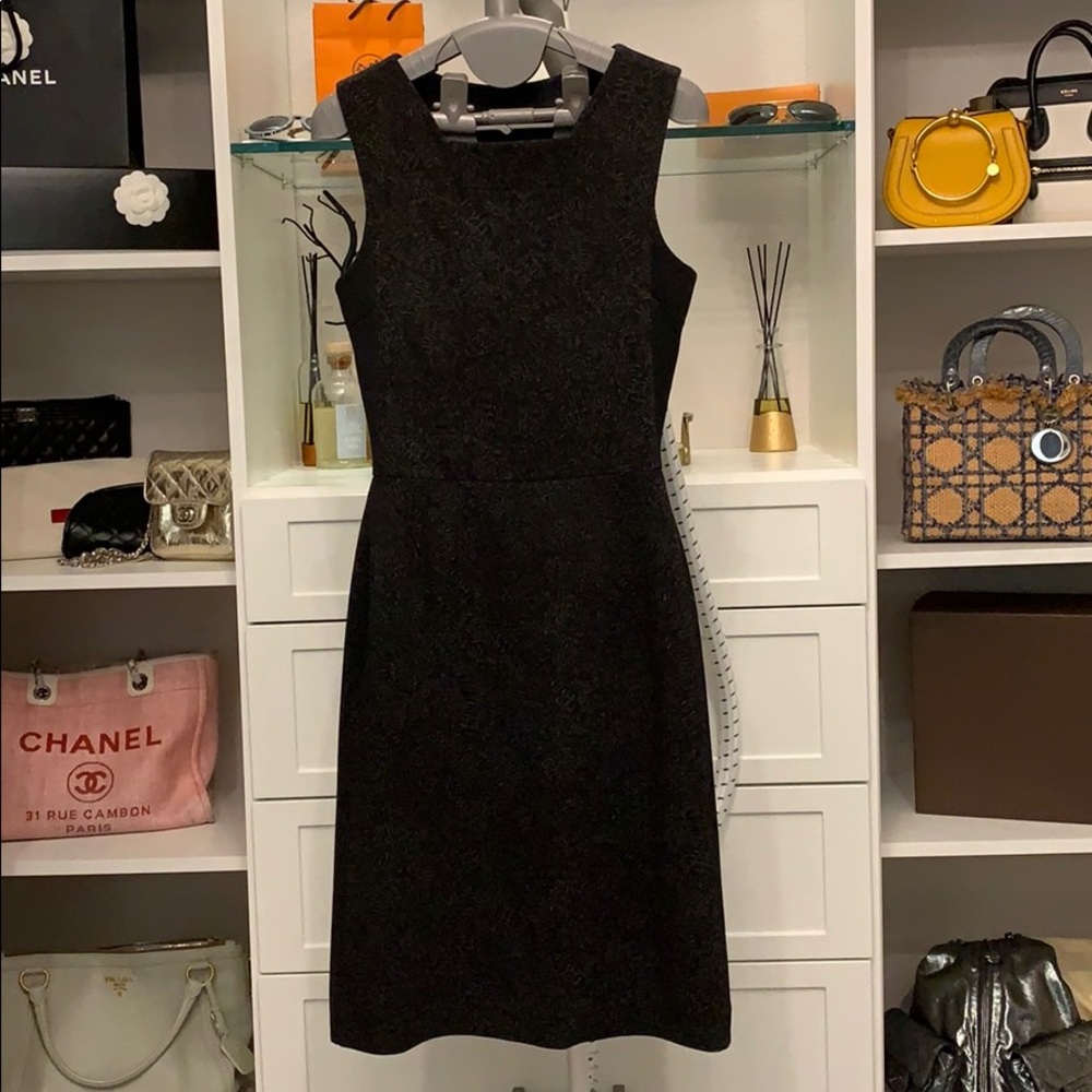 Form fitting dress black with design.